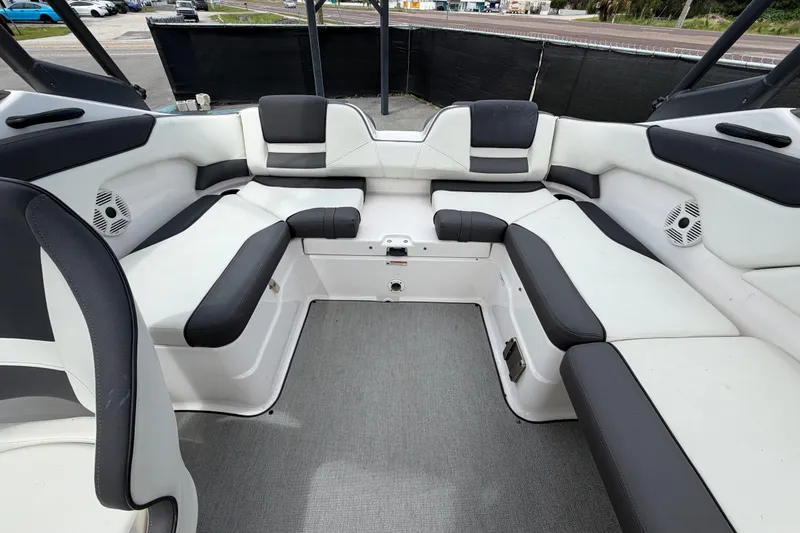 Slide: The Image of 2022 Yamaha Boats AR210 interior with spacious seating and modern design. - 51