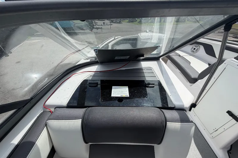 Slide: The Image of Interior view of 2022 Yamaha AR210 boat, featuring seating and dashboard area. - 19