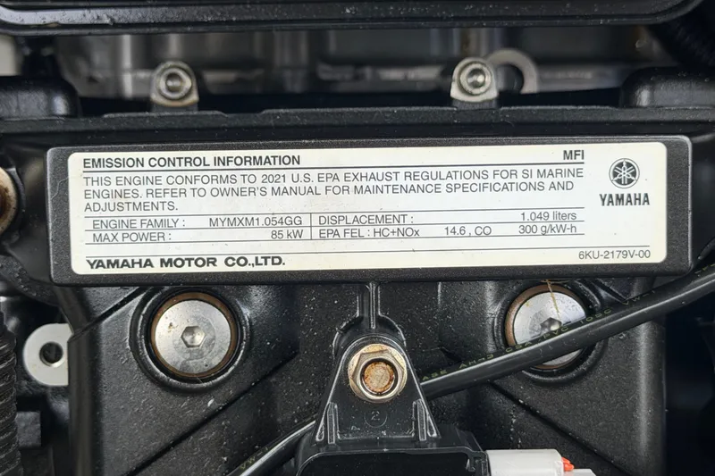 Slide: The Image of Engine label of 2022 Yamaha Boats AR210, showing emission control information and specifications. - 63