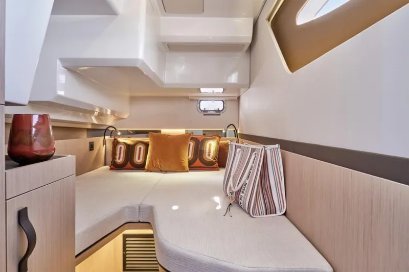 Slide: The Image of Manufacturer Provided Image: Luxurious interior cabin of 2025 Four Winns TH36 yacht with modern decor and cozy seating. - 6