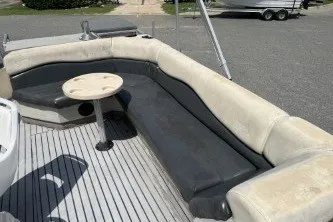 Slide: The Image of 2002 Fisher Freedom 220 DLX FISH boat with spacious seating and small table. - 8