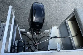 Slide: The Image of 2002 Fisher Freedom 220 DLX FISH boat engine and battery compartment. - 10