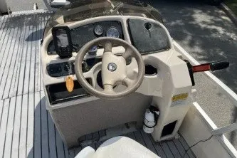 Slide: The Image of 2002 Fisher Freedom 220 DLX FISH boat console with steering wheel and gauges. - 7