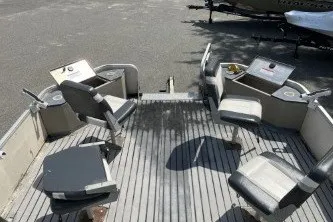 Slide: The Image of 2002 Fisher Freedom 220 DLX FISH boat interior with seating and fishing setup. - 6