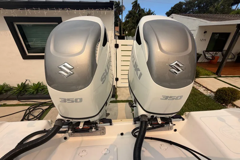 Slide: The Image of Twin Suzuki 350 outboard engines on a 2023 Sea Pro 320 DLX Offshore boat. - 43