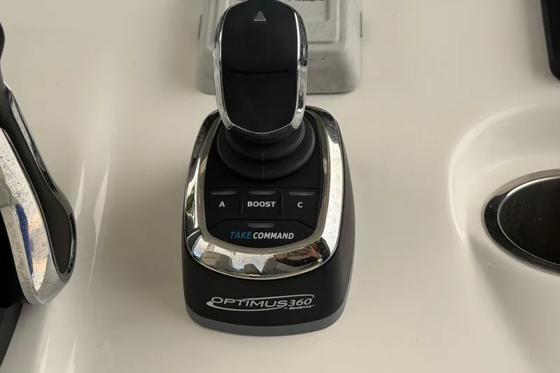 Slide: The Image of Optimus 360 joystick control on 2023 Sea Pro 320 DLX Offshore boat dashboard. - 27