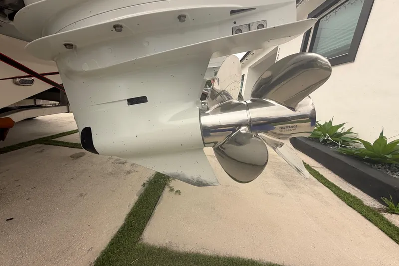 Slide: The Image of Close-up of a 2023 Sea Pro 320 DLX Offshore boat propeller in a driveway. - 8