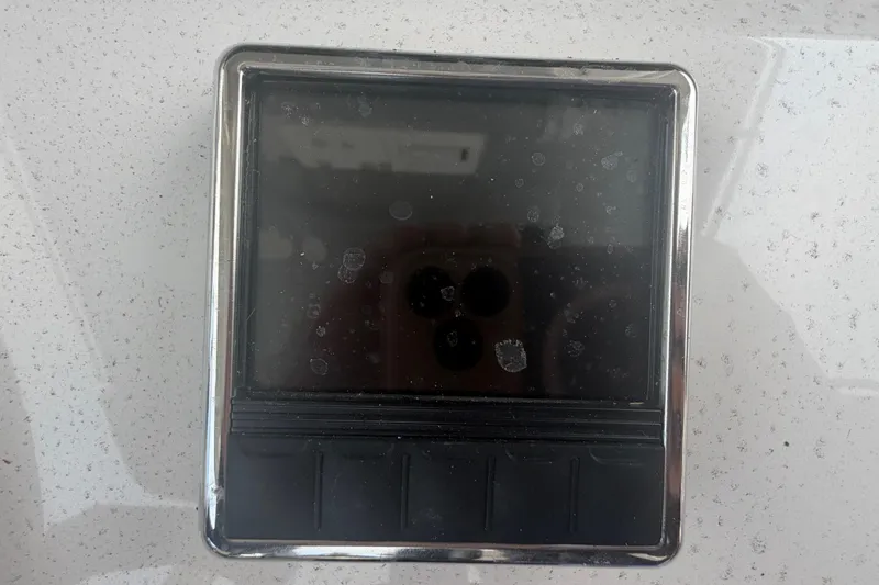 Slide: The Image of Close-up of a display panel on a 2023 Sea Pro 320 DLX Offshore boat. - 24
