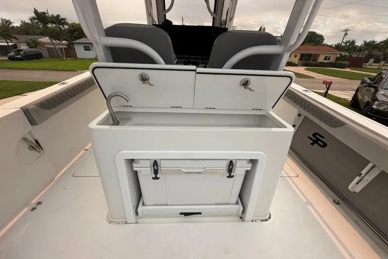 Slide: The Image of 2023 Sea Pro 320 DLX Offshore boat interior with storage and sink. - 16