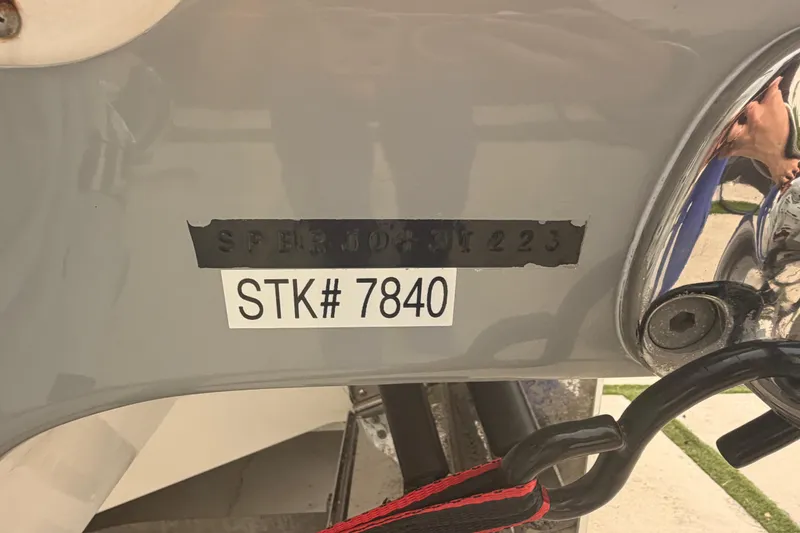 Slide: The Image of 2023 Sea Pro 320 DLX Offshore boat with serial number and stock tag visible. - 62