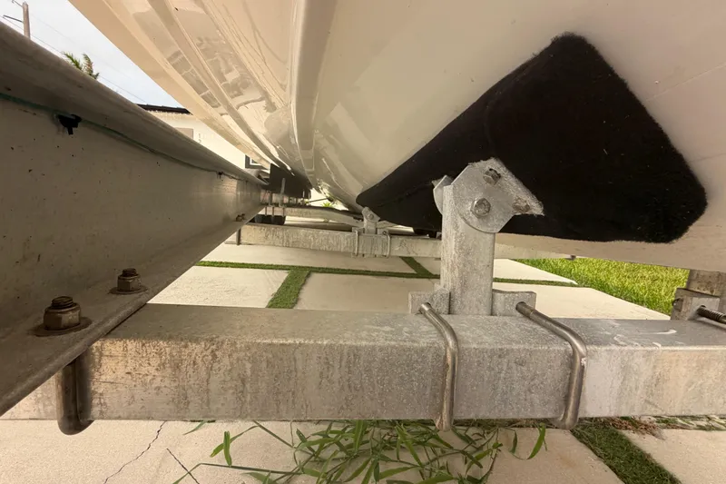 Slide: The Image of 2023 Sea Pro 320 DLX Offshore boat on trailer, underside view. - 55