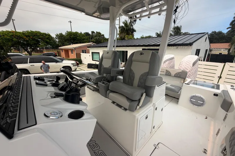 Slide: The Image of 2023 Sea Pro 320 DLX Offshore boat interior with modern helm and seating. - 38