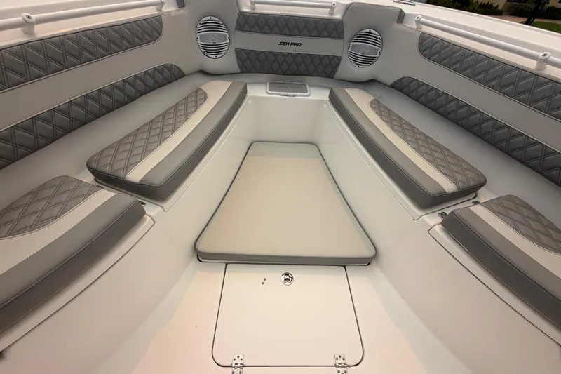Slide: The Image of Luxurious seating area of 2023 Sea Pro 320 DLX Offshore boat with quilted cushions. - 32