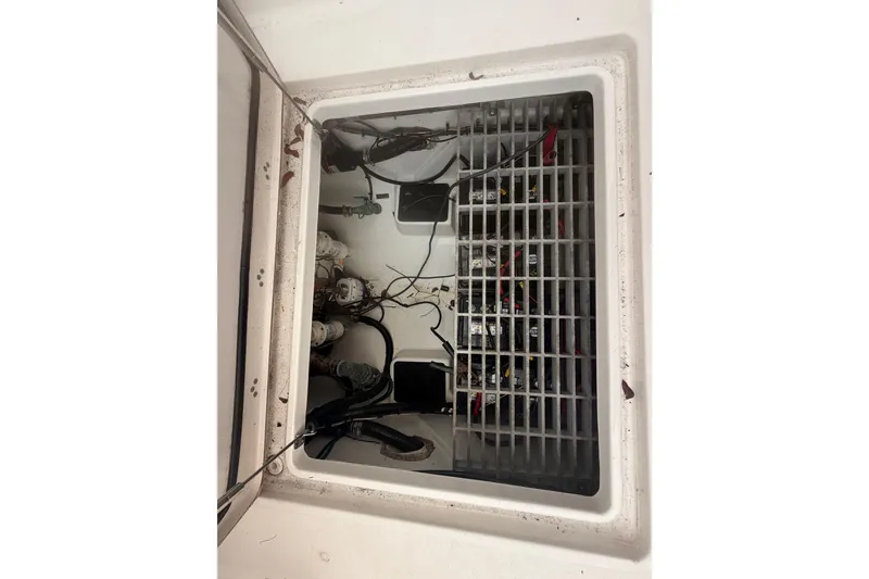 Slide: The Image of 2023 Sea Pro 320 DLX Offshore boat compartment with wiring and equipment. - 60