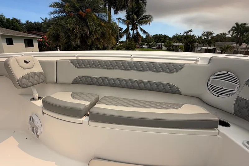 Slide: The Image of Luxurious seating on 2023 Sea Pro 320 DLX Offshore boat, featuring diamond-stitched upholstery. - 36