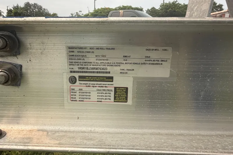 Slide: The Image of Label on trailer showing specifications and safety standards for Sea Pro 320 DLX Offshore, 2023. - 44
