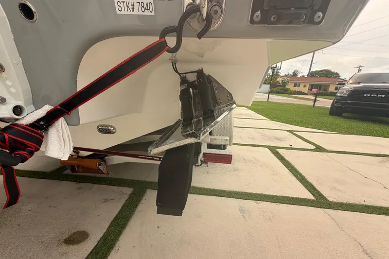Slide: The Image of 2023 Sea Pro 320 DLX Offshore boat trailer hitch with safety strap and towel. - 7