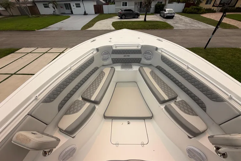 Slide: The Image of Luxurious seating area on a 2023 Sea Pro 320 DLX Offshore boat, showcasing elegant design. - 31