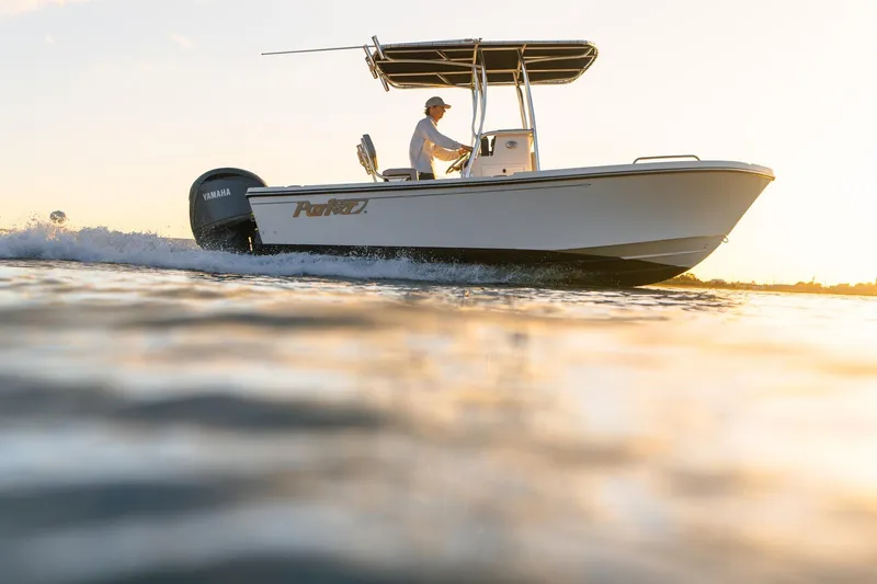 Slide: The Image of 2026 Parker 180 Coastal boat cruising at sunset on calm waters. - 0