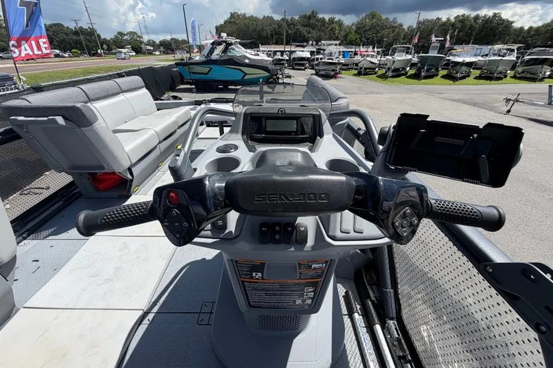 Slide: The Image of 2023 Sea-Doo Switch Cruise 21 dashboard and steering, showcasing modern controls and seating. - 37
