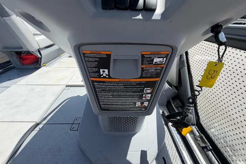 Slide: The Image of 2023 Sea-Doo Switch Cruise 21 interior with safety warnings and key tether. - 43