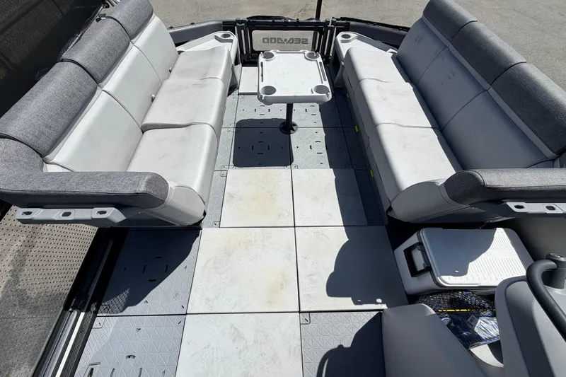 Slide: The Image of 2023 Sea-Doo Switch Cruise 21 interior with spacious seating and central table. - 48
