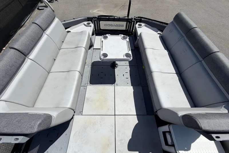 Slide: The Image of 2023 Sea-Doo Switch Cruise 21 interior with spacious seating and central table. - 49