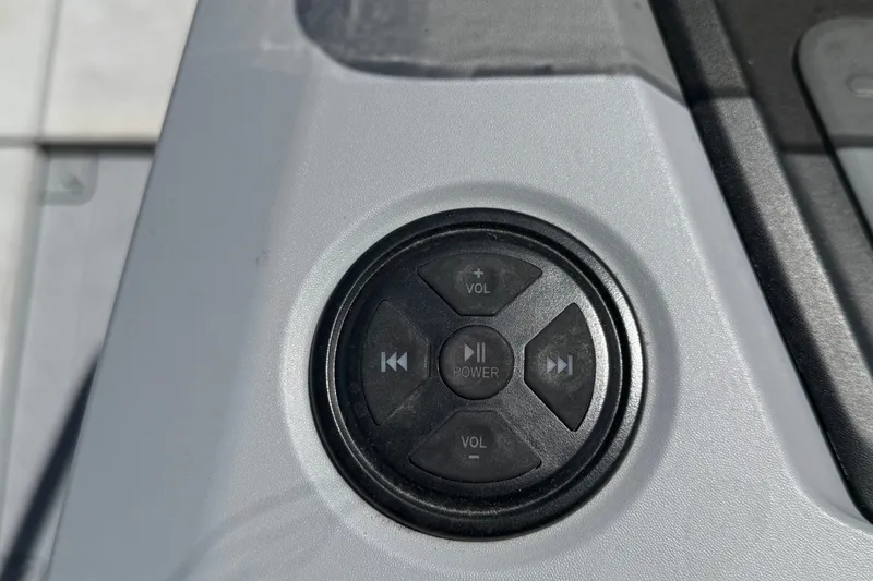 Slide: The Image of Control panel of 2023 Sea-Doo Switch Cruise 21 with volume and power buttons. - 40