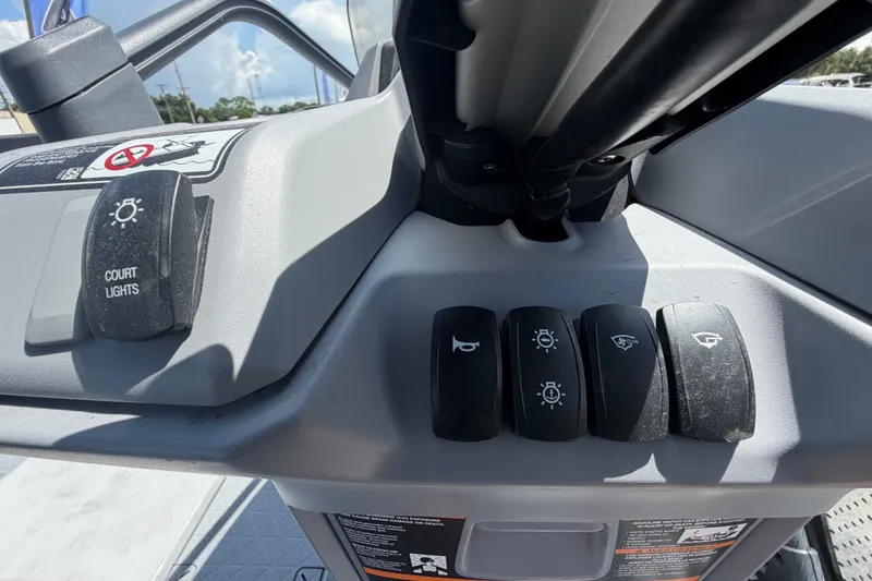 Slide: The Image of Control panel of 2023 Sea-Doo Switch Cruise 21 with various switches and buttons. - 41