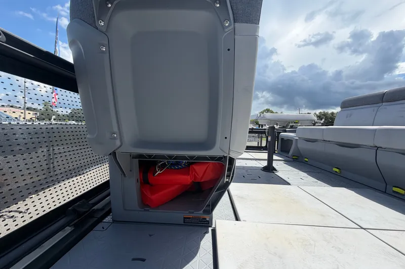 Slide: The Image of 2023 Sea-Doo Switch Cruise 21 interior storage compartment with seating and open sky view. - 47