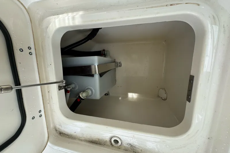 Slide: The Image of Storage compartment of a 2021 Boston Whaler 320 Vantage boat, showing interior details. - 65