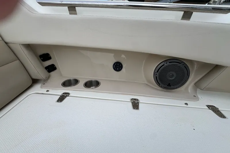 Slide: The Image of Interior of 2021 Boston Whaler 320 Vantage boat with speaker and cup holders. - 88