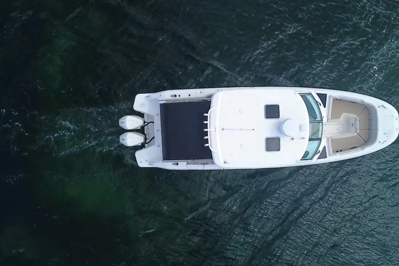 Slide: The Image of Aerial view of 2021 Boston Whaler 320 Vantage boat on water. - 11