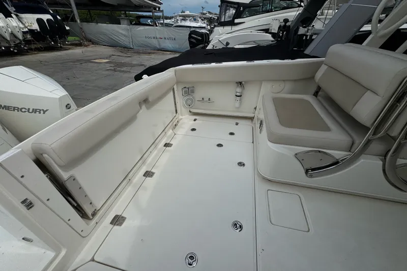 Slide: The Image of 2021 Boston Whaler 320 Vantage boat interior with seating and storage compartments. - 32