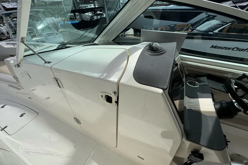 Slide: The Image of 2021 Boston Whaler 320 Vantage boat interior with helm and seating area. - 96