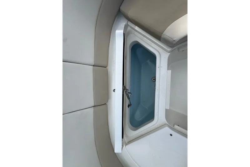 Slide: The Image of 2021 Boston Whaler 320 Vantage boat storage compartment with cushioned seating. - 90