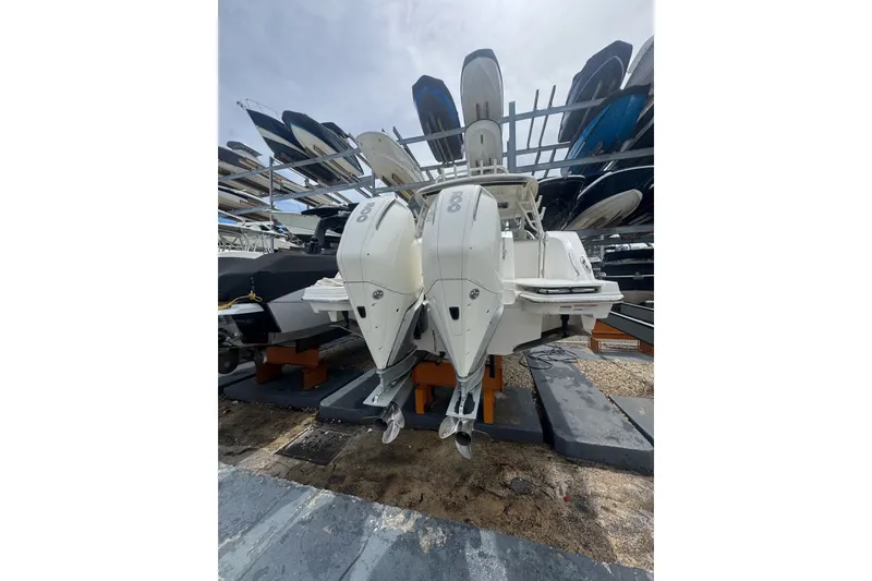Slide: The Image of 2021 Boston Whaler 320 Vantage boat with dual engines in storage. - 23