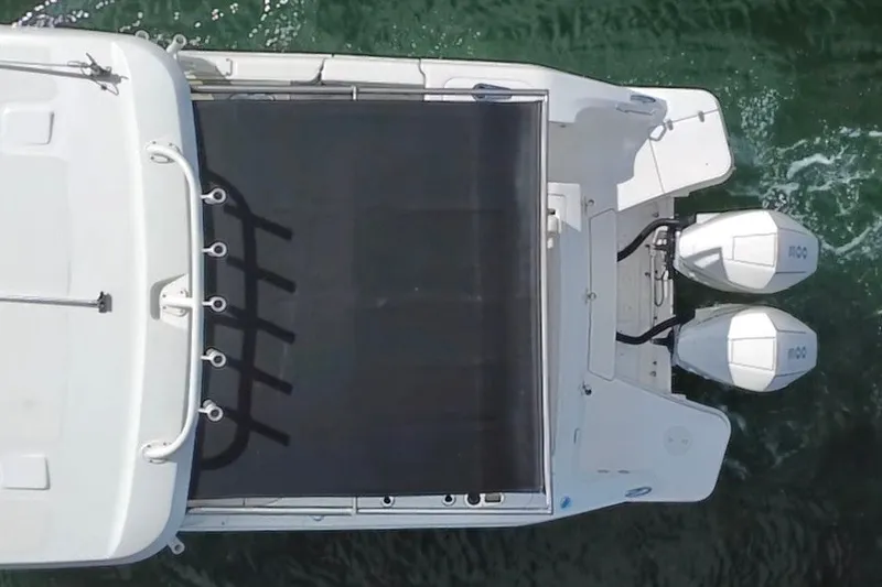 Slide: The Image of Top view of 2021 Boston Whaler 320 Vantage boat with dual outboard engines. - 15