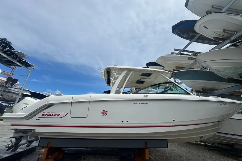 The Image of 2021 Boston Whaler 320 Vantage boat displayed in a marina storage facility. - 0