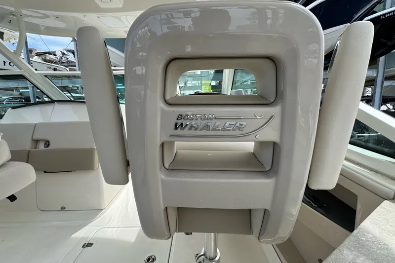 Slide: The Image of 2021 Boston Whaler 320 Vantage interior, featuring branded seating and sleek design elements. - 54