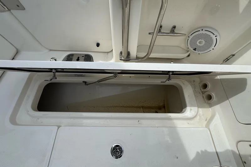Slide: The Image of Open storage compartment on a 2021 Boston Whaler 320 Vantage boat deck. - 44