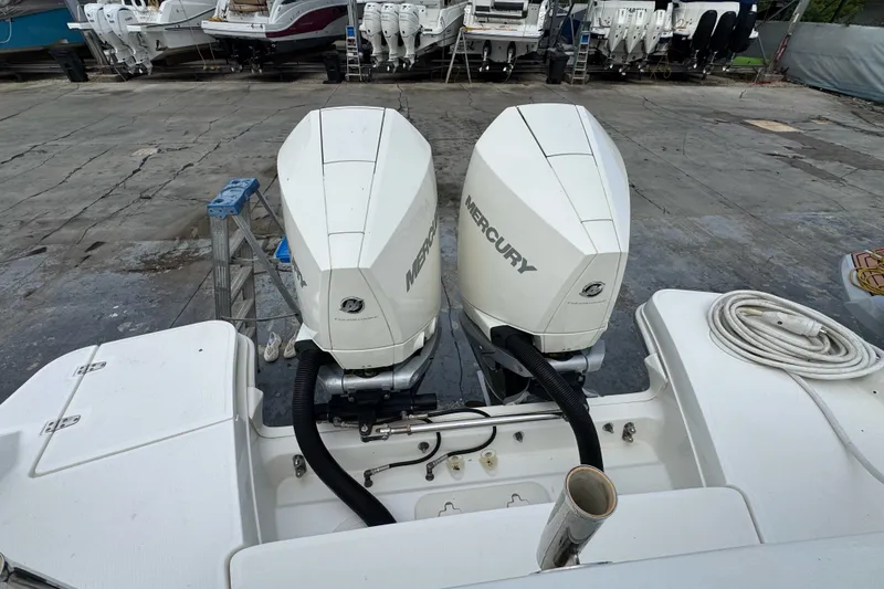 Slide: The Image of Twin Mercury outboard engines on a 2021 Boston Whaler 320 Vantage boat. - 25