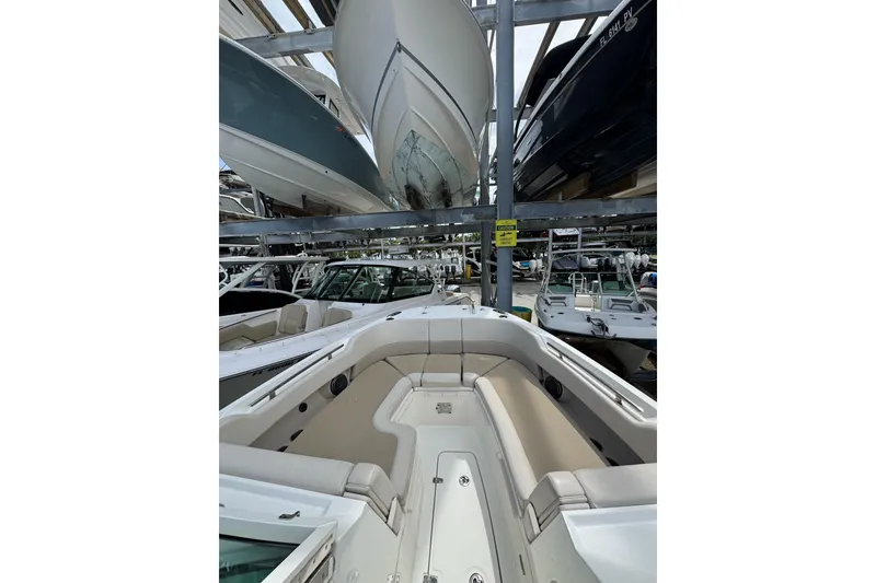 Slide: The Image of 2021 Boston Whaler 320 Vantage boat in storage, showcasing spacious seating and sleek design. - 76