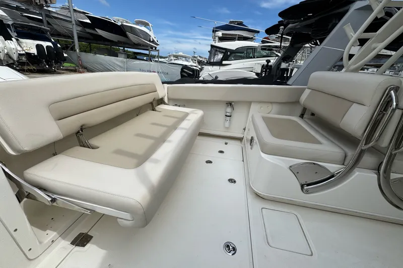 Slide: The Image of 2021 Boston Whaler 320 Vantage interior with beige seating and sleek design. - 31