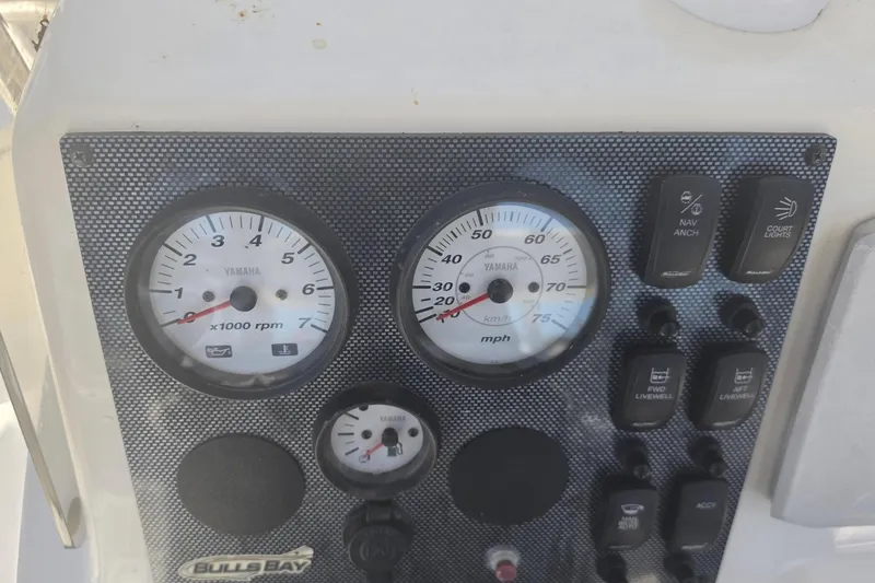 Slide: The Image of Dashboard of a 2021 Bulls Bay 2200 boat with Yamaha gauges and control switches. - 35