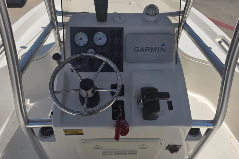 Slide: The Image of 2021 Bulls Bay 2200 boat console with Garmin navigation and steering wheel. - 31