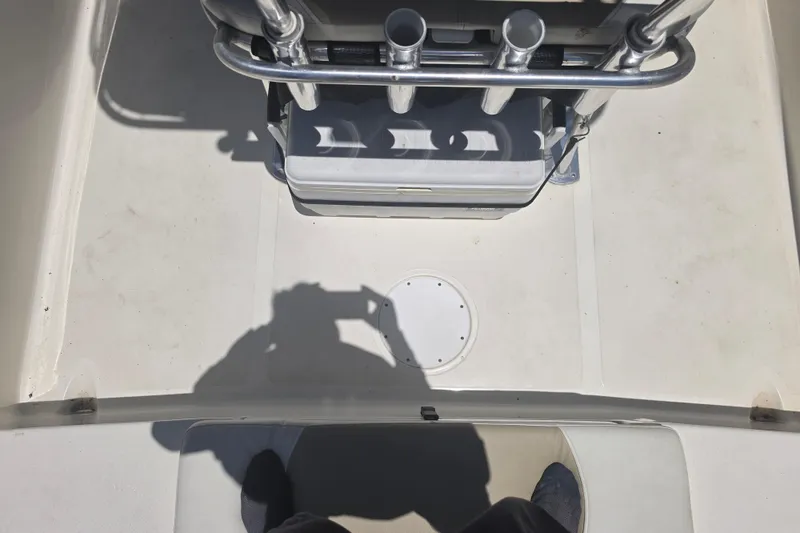 Slide: The Image of Interior view of a 2021 Bulls Bay 2200 boat, featuring rod holders and seating. - 27