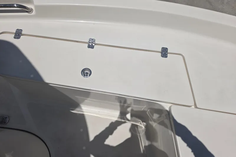 Slide: The Image of 2021 Bulls Bay 2200 boat deck with storage compartment and metal hinges. - 59