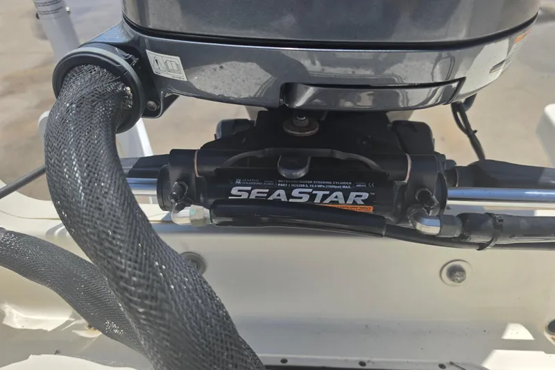 Slide: The Image of Close-up of SeaStar hydraulic steering on a 2021 Bulls Bay 2200 boat. - 87