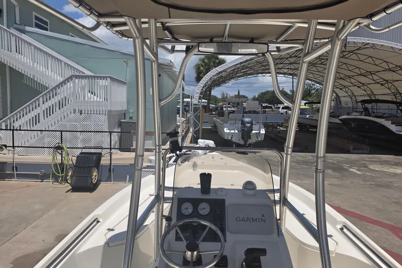 Slide: The Image of 2021 Bulls Bay 2200 boat with Garmin system, docked under canopy. - 28